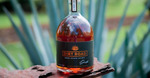 Win a Bottle of Dirt Road Dark Agave Spirit from Tropic Group