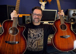 Win 1 of 2 Acoustic Guitars from Faith Guitars